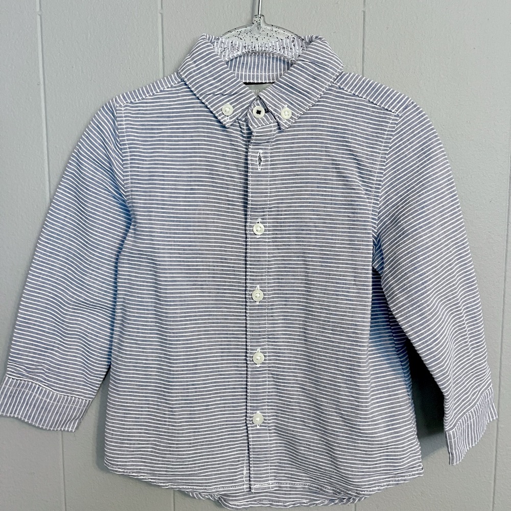 Seer sucker button down shirt. Blue background with white stripe.